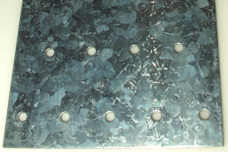 Close-up of a galvanised steel surface showing zinc crystallisation after hot-dip
