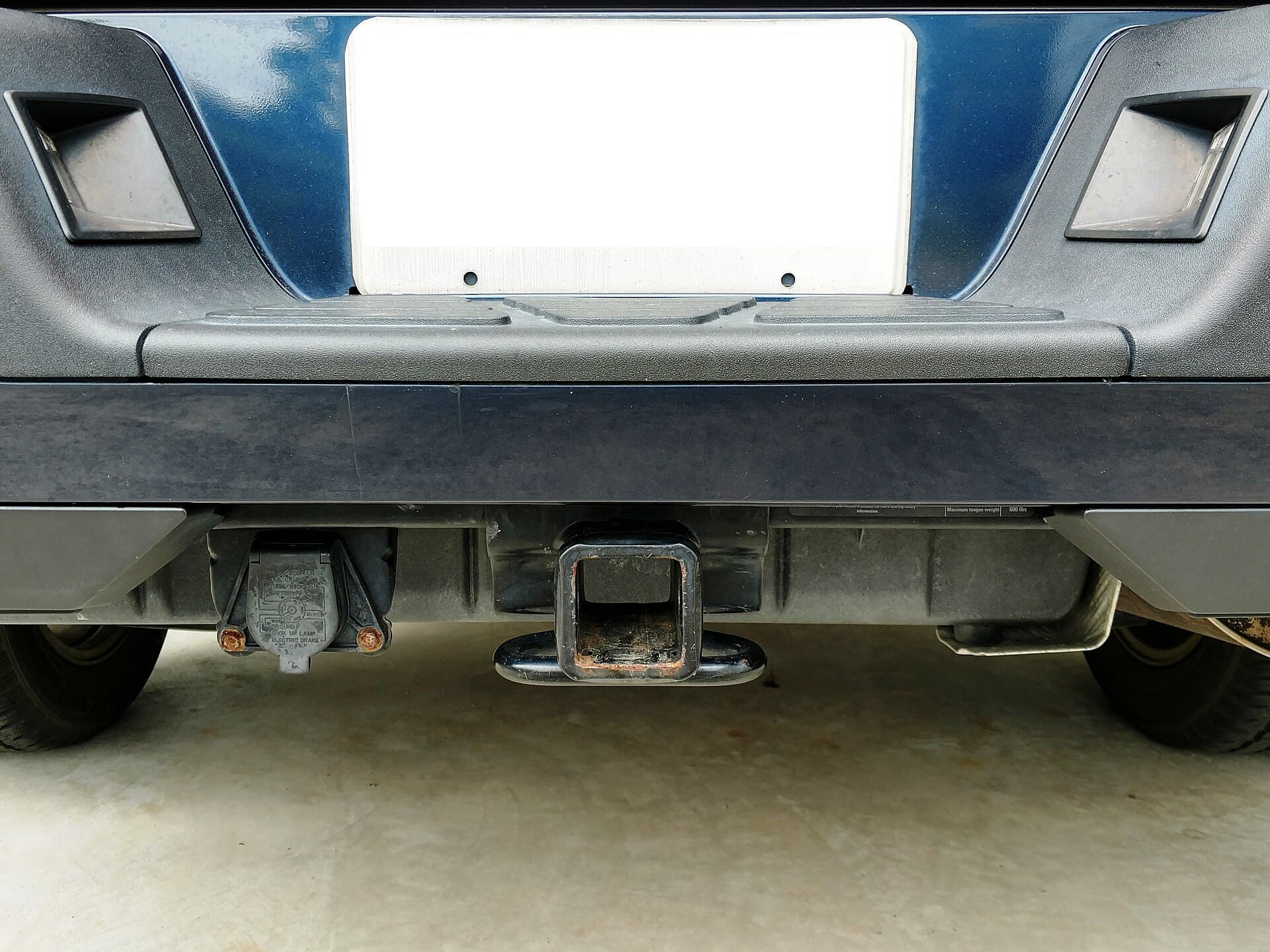 Class III tow hitch with a 7-pin blade trailer connector on a vehicle bumper